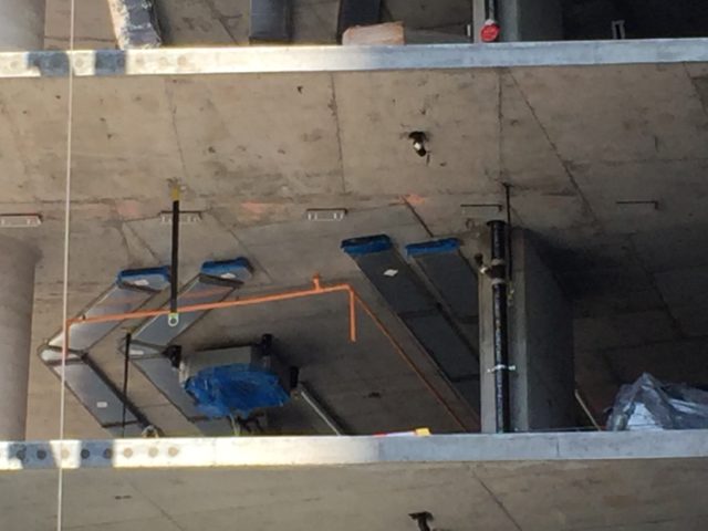 Interior duct work and sprinklers being installed